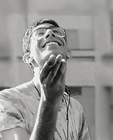 Tony Pizzigati looks upward as holds a piece of chalk